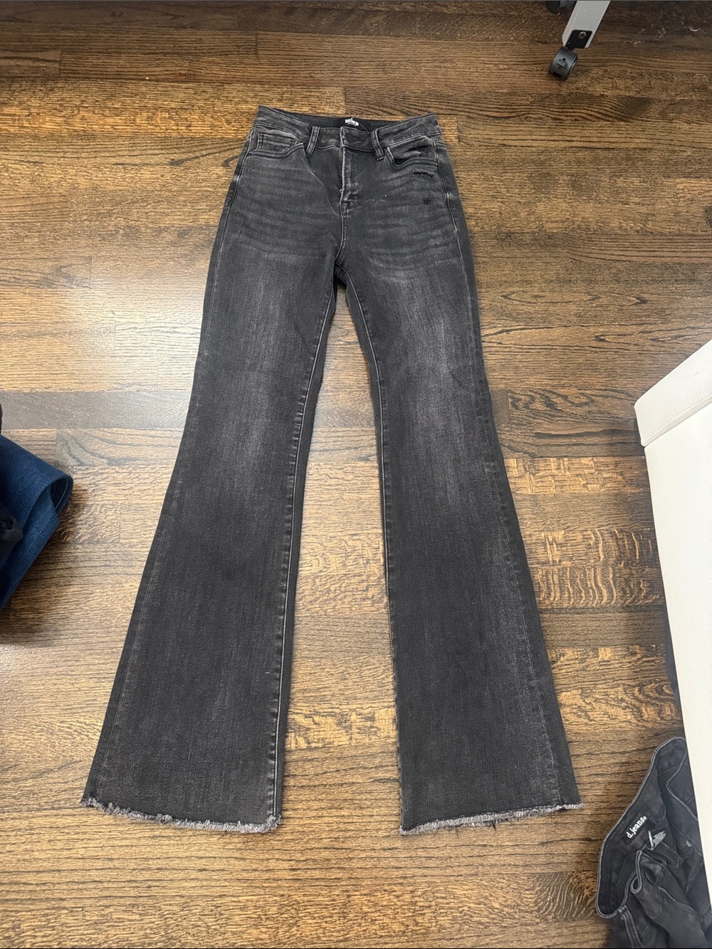 High-Rise Black Flared Jeans with Raw Hem